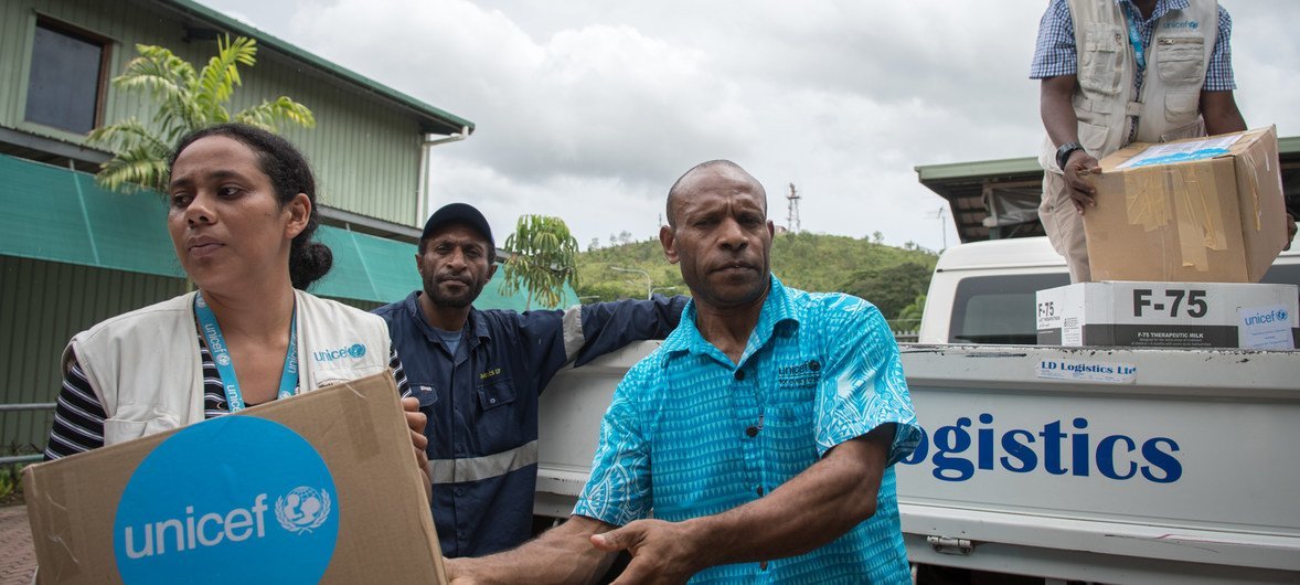 UNICEF staff unload emergency supplies in Port Moresby, Papua New Guinea for earthquake response efforts.