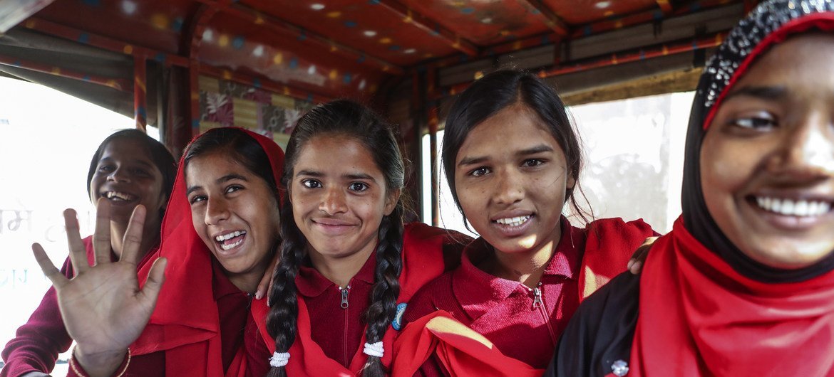 Girls who have fought child marriage go to school using a transport facility provided in the village of Berhabad, India.