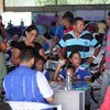 O Acnur Brasil e parceiros apoiam as autoridades locais no registro de venezuelanos que vivem no abrigo de Tancredo Neves, Boa Vista, Roraima.
