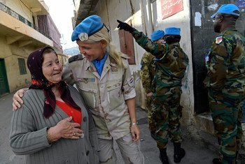 Lt. Colonel Ella Van Den Heuvel of the Netherlands interacting with a local resident while patrolling in Rmeish, South Lebanon (December 2017).