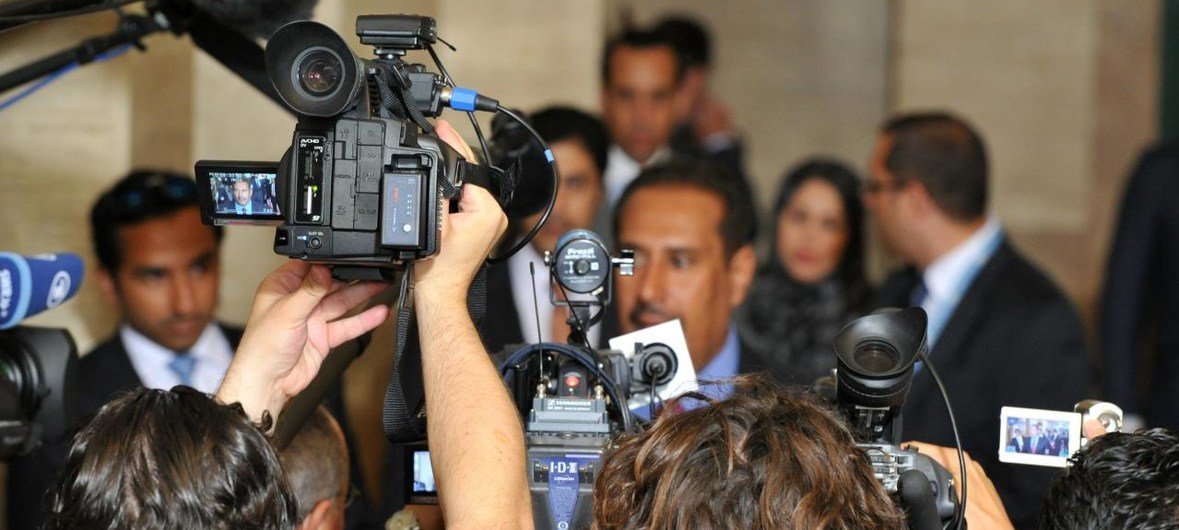 Journalists at a press stakeout. Recently, there has been a noticeable increase in harassment of journalists, with women bearing the brunt of online attacks.
