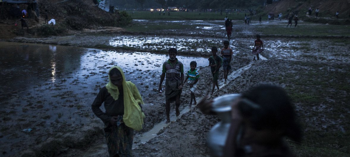 Rohingya refugees walk across the Balukhali settlement in Bangladesh's Cox Bazar district.