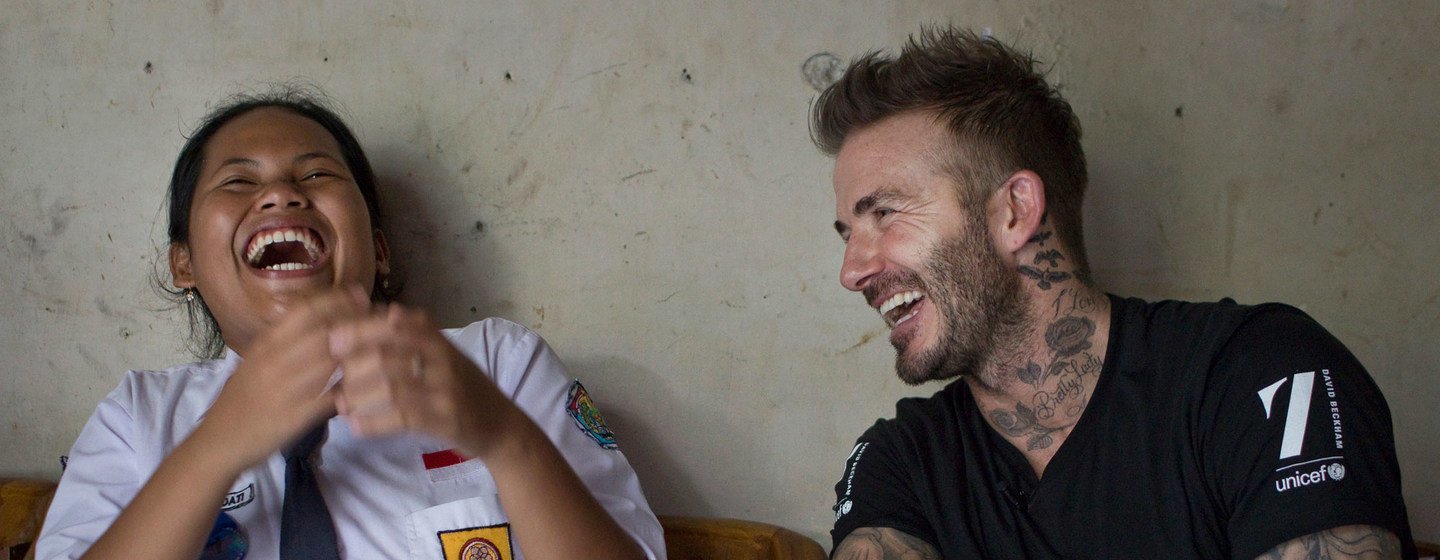 UNICEF Goodwill Ambassador David Beckham shares a laugh with 15-year-old Sripun at her home in Semarang, Indonesia, in 2015. (file)