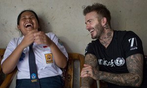 UNICEF Goodwill Ambassador David Beckham shares a laugh with 15-year-old school girl Sripun at her home in Semarang, Indonesia.
