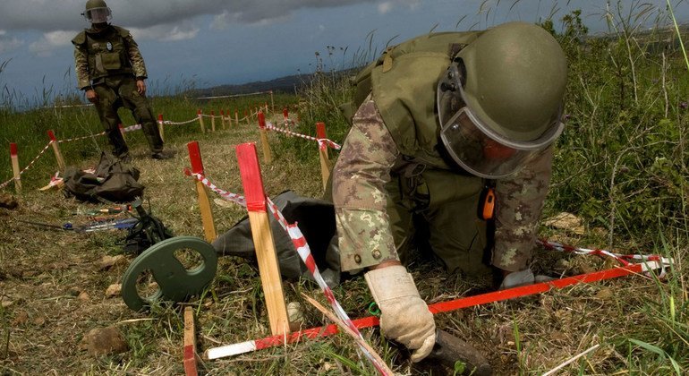 Italian deminers clear an area close to the Blue Line near Yaroun village. Mine clearance activities are vital to enabling the peacekeeping mission to deploy and carry out its operations. (8 April 2010)