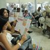 Des réfugiés vénézuéliens attendent l'embarquement à l'aéroport de Boa Vista, dans l'État de Roraima. Crédit : Reynesson Damasceno.
