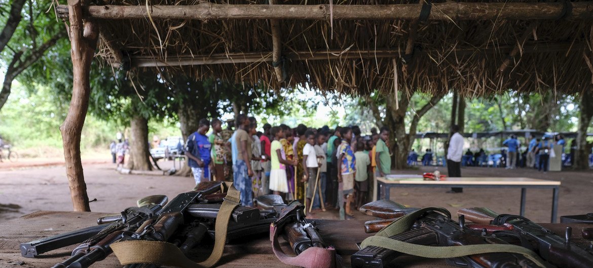 Firearms laid down by child soldiers associated with armed groups in South Sudan. The formal discharge ceremony saw the release of 207 child soldiers, some of whom are in the background.