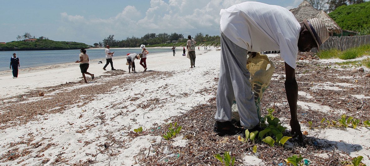 Local people from Watamu, Kenya, work with Local Ocean Conservation to pick up plastic on the beach.
