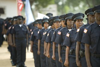 Liberian National Police officers attend their graduation ceremony. This graduating batch included 104 new female officers.