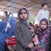 Afghan refugees at a UNHCR voluntary repatriation centre in the Pakistani city of Peshawar. After decades in Pakistan, more Afghan refugees have begun to return.