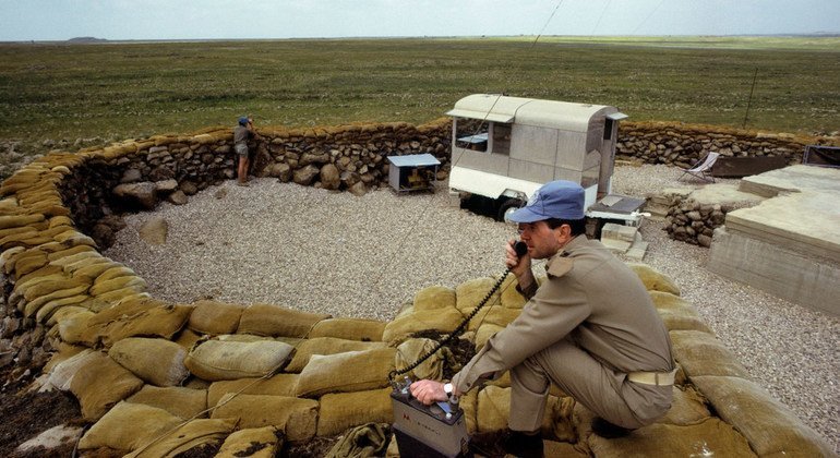 Capt. Giorgio Battisti (foreground) of Italy reports from the Golan Heights as part of his work with the UN mission tasked with supervising the armistice agreements between Israel and its Arab neighbours, known as UNTSO. (26 April 1973) 