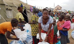 Displaced persons collect relief supplies in Ituri province, north-east DRC.  Interethnic violence has ravaged the Ituri Province since December 2017.