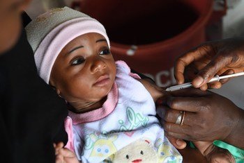 A little girl being vaccinated in the town of Bouaké, in Côte d'Ivoire. Immunization in the country is free for children bellow one year old, but three out of five children do not get vaccinated before their first birthday.