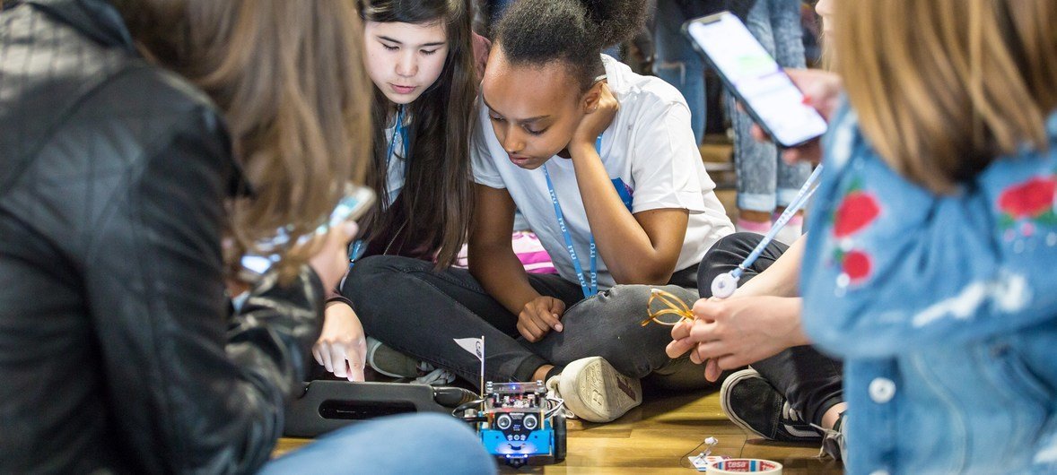 On Girls in ICT Day, these young girls, learning programming and coding for a small robot, are among over 150 participants taking part in interactive workshops and mentoring sessions at ITU headquarters in Geneva, Switzerland.