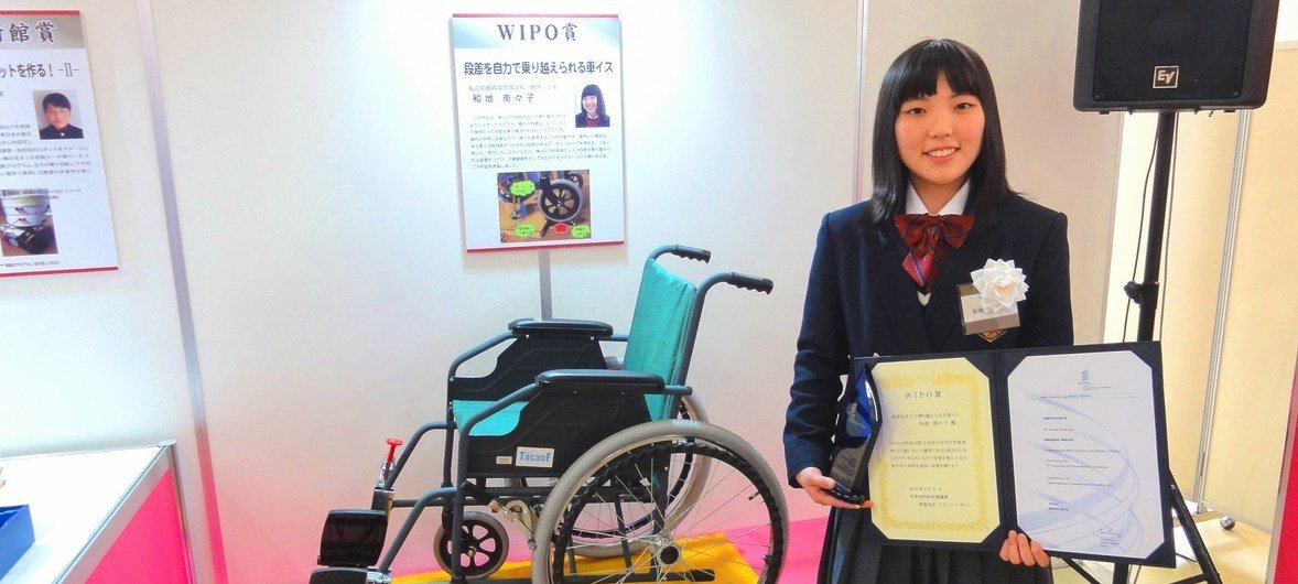 High-school student Nanako Wachi, inventor of a novel wheelchair that easily moves over steps, with a WIPO Award received for her invention. (file)