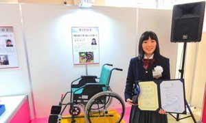 High-school student Nanako Wachi, inventor of a novel wheelchair that easily moves over steps, with a WIPO Award received for her invention. (file)