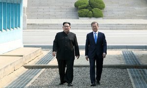 President Moon Jae-in (right) of the Republic of Korea greets Chairman of the State Affairs Commission Kim Jong-Un of the DPRK in Panmunjeom, during the April 2018 inter-Korean summit. 