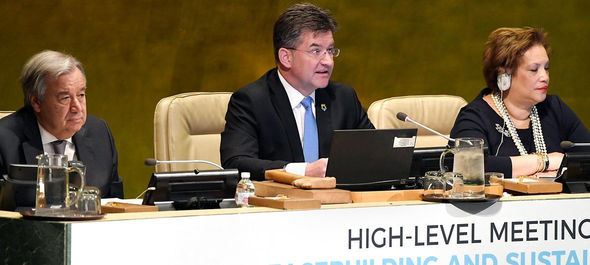 General Assembly President Miroslav Lajčák (centre) chairs high-level meeting on peacebuilding and sustaining peace. He is flanked by Secretary-General Guterres (left) and Catherine Pollard, USG for General Assembly Affairs and Conference Management.