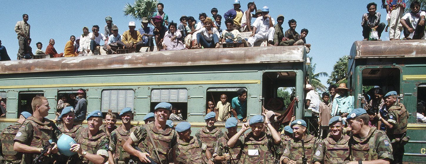 Dutch troops, from the UN Transitional Authority in Cambodia (UNTAC), guarding a train with refugees returning to Cambodia from camps in Thailand (file, 1993)