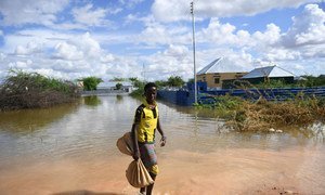 A young boy walks through a flooded residential area in the Somali town of Belet Weyne on 30 April 2018. Belet Weyne is currently experiencing severe flooding, and over 150,000 people have been displaced.