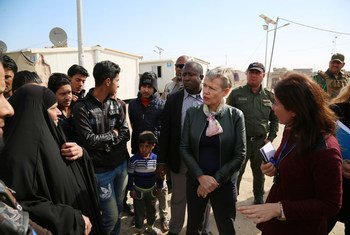 Deputy Special Representative Alice Walpole visits internally displaced families in Baghdad’s Abu Ghraib district in February 2018 to underline the importance of exercising the right to vote in upcoming elections.