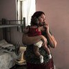 Refugiada de Honduras com seu bebê em abrigo no México