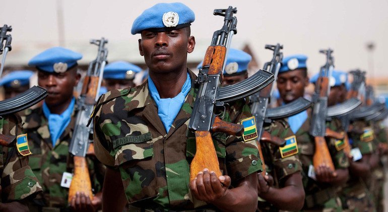 Rwandan peacekeepers march at UNAMID’s headquarters in El Fasher during the 2012 commemoration of the International Day of United Nations Peacekeepers.