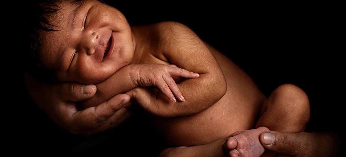 A mother holds her seven-day-old baby daughter, who was born at a health centre in Peru's Paruro province.