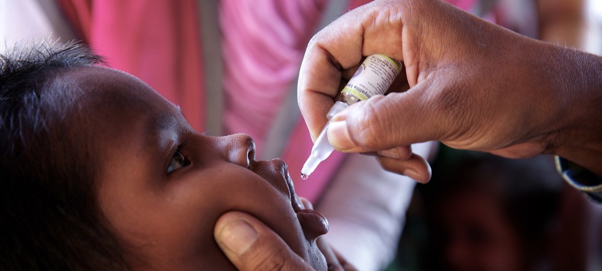 A Rohingya refugee child is administered an oral polio vaccine at an immunization centre in Bormapara makeshift settlement, Cox's Bazar, Bangladesh.