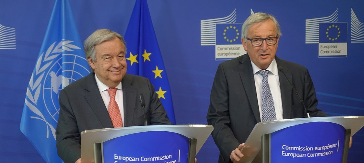 Secretary-General António Guterres (left) and Jean-Claude Juncker, President of the European Commission, address reporters at a press briefing in Brussels.