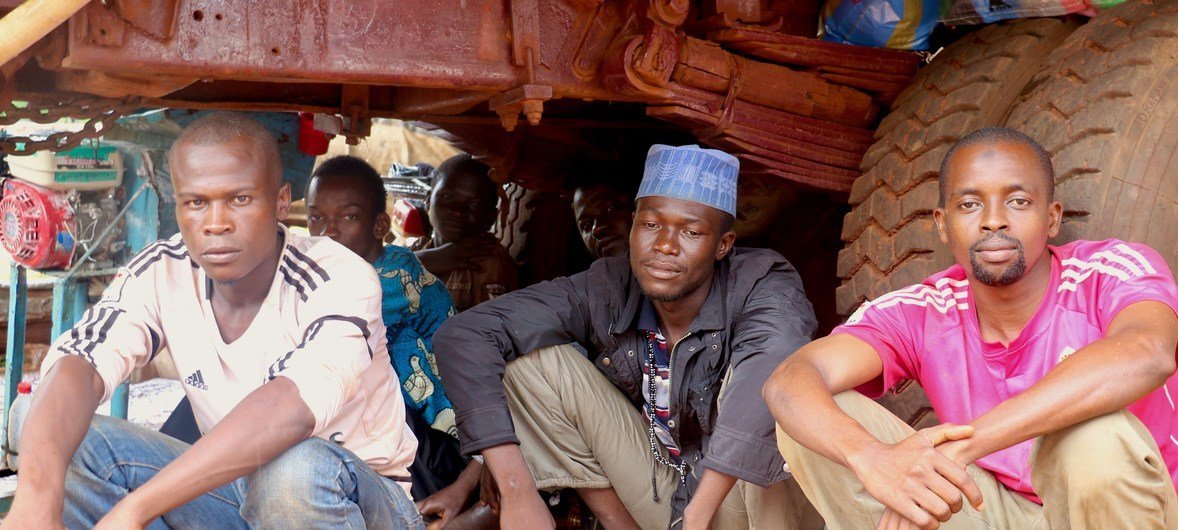 Moussa, Idriss and Mahmoud (left to right) have found shelter under a truck in Bangassou in the Central African Republic after they were displaced by violence. (file)