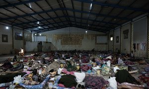 Migrants lie on mattresses inside a detention centre, located in Libya. (file)