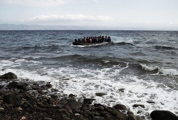 On 13 September 2015, asylum-seekers, most of them from the Syrian Arab Republic, on a large raft arrive on the shores of the island of Lesbos, in the North Aegean region.