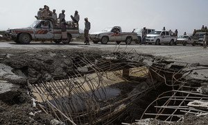 Cars and trucks wait in line to pass over a bridge that was hit by an airstrike in 2016. This road is one of four roads linking Hodeida (Al Hudayda) with the rest of the country.