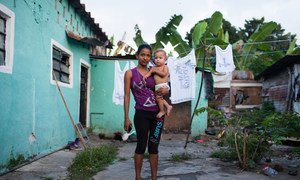 Genesis Cerrato, 16, with her one-year-old son. Along with her whole family, she fled Honduras escaping violence in her home country.  