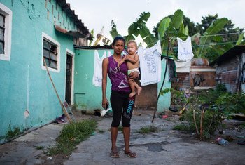 Genesis Cerrato, 16, with her one-year-old son. Along with her whole family, she fled Honduras escaping violence in her home country.  