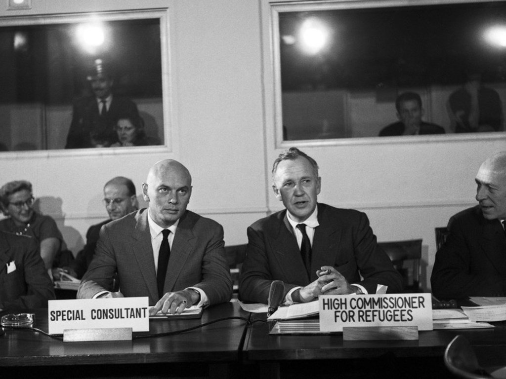 Stage and screen actor Yul Brynner, Special Consultant, and Dr. Auguste Lindt, UN High Commissioner for Refugees, attend a meeting of the UNHCR Executive Committee in Geneva in 1960. (file)