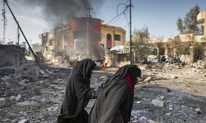  Civilians in Mosul, Iraq, following a suicide car bombing (file photo).