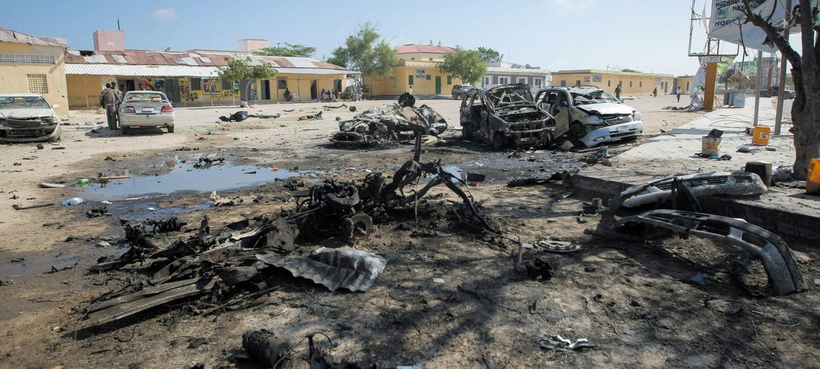 Destroyed cars near a popular restaurant in the Somali capital, Mogadishu, after a double suicide attack by Al-Qaeda-affiliated extremist group Al Shabaab that killed 18 people and injured dozens more.