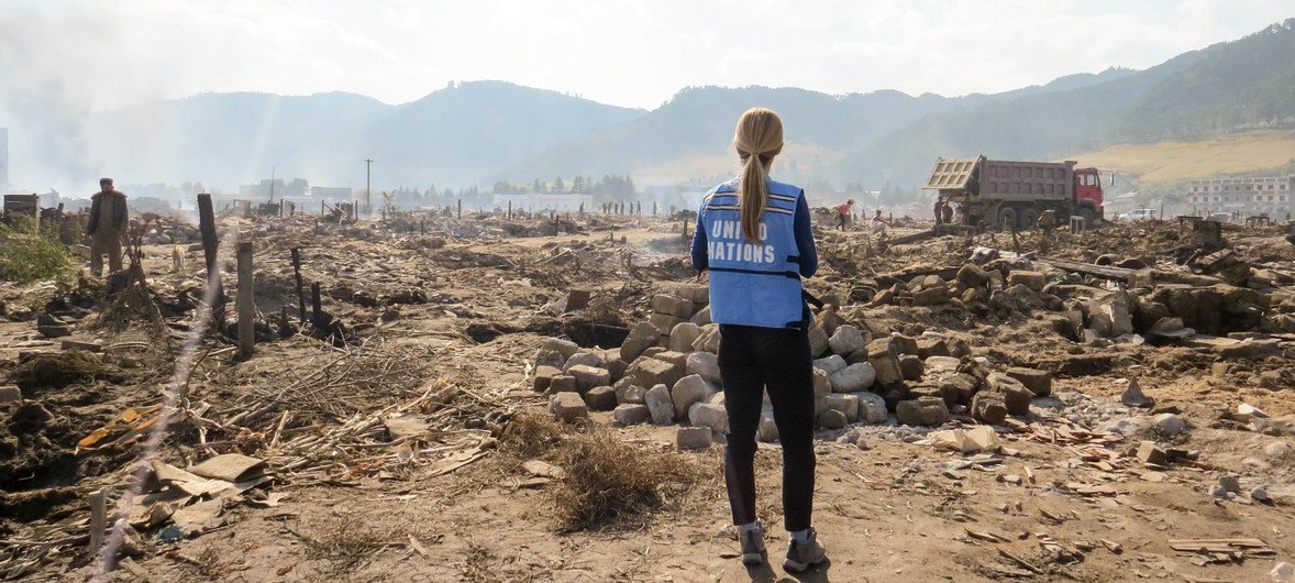 A UN aid worker surveys the damage in the aftermath of devastating floods that hit the Democratic People’s Republic of Korea (DPRK) in September 2016.