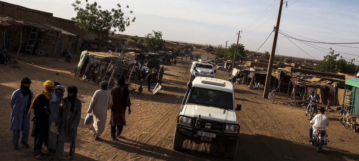 A MINUSMA convoy drives along a street Menaka, north-eastern Mali. The region has witnessed a sharp escalation in violence and insecurity.