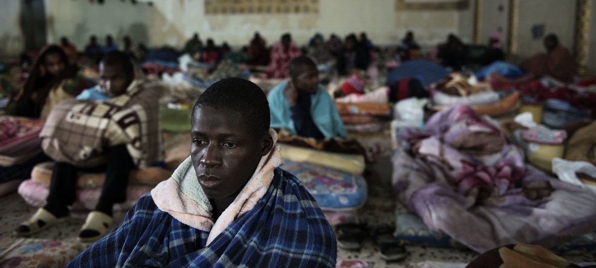 Migrants sit on mattresses laid on the floor at a detention centre, located on the outskirts of Tripoli, Libya, Wednesday 1 February 2017.