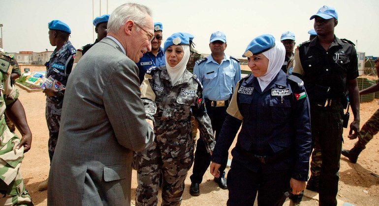 Assistant Secretary-General for Peacekeeping Operations Edmond Mulet greets two police advisors from Jordan during his June 2012 visit to the West Darfur team site of the UN-African Union Hybrid Operation in Darfur (UNAMID).