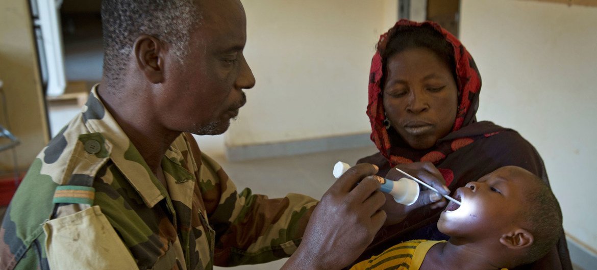 A Malian child receives a free consultation at a medical clinic in Gao run by the Nigerien contingent of the UN mission in the country, known by its French acronym, MINUSMA.