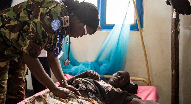 Kenyan peacekeepers serving in South Sudan’s Warrap State, Medical Officer Captain Njuki, examines a pregnant woman suffering from malaria, a condition which can sometimes lead to miscarriages.