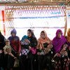 Rohingya refugee mothers wait for their children to be assessed at an Outpatient Therapeutic Feeding Programme (OTP) center at Unchiprang makeshift settlement in Teknaf, Cox’s Bazar, Bangladesh, Tuesday 2 January 2018.