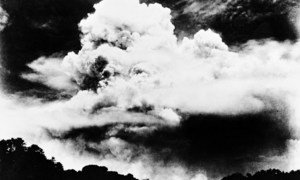 Atomic cloud spreading over Nagasaki as seen from about 3 kilometres south of the hypocentre about noon on 9 August 1945.