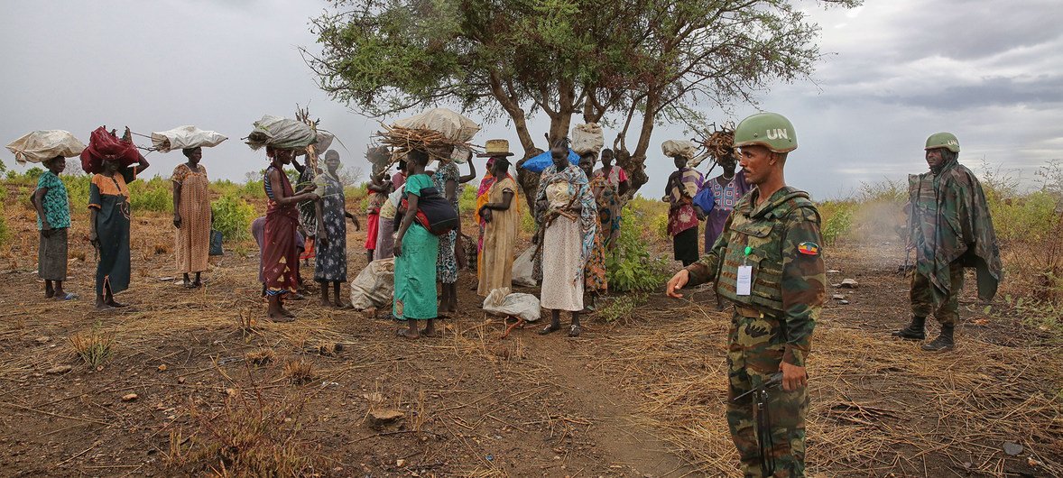 Ethiopian peacekeepers deployed to the United Nations Mission in South Sudan (UNMISS) escort a group of women outside a UN-run site and create a safe perimeter within which they can search for firewood without being at risk of attack, 28 March 2017.