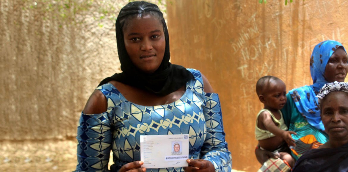 Ahead of Mali's 2018 presidential elections, this young women is picking up her new voter's card at an electoral station in Gao, in the country's north.