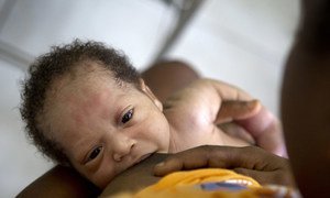 A woman breast feeds her premature baby at the UNICEF supported Maternity ward of the State University Hospital in Port au Prince, Haiti.